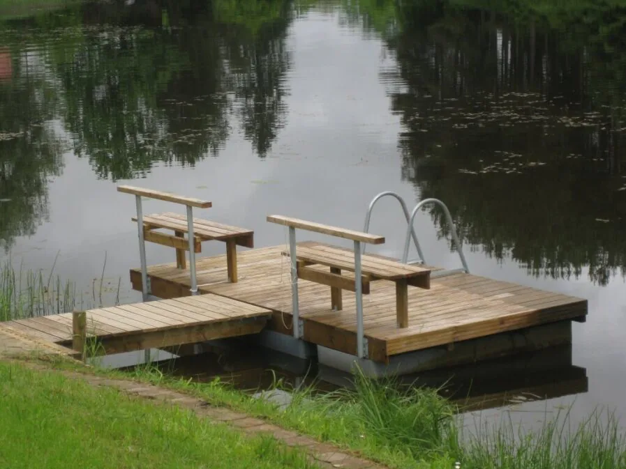 Top Marine Swimming Pontoons ECO with seating, offering an eco-friendly and durable solution for recreational waterfront areas.